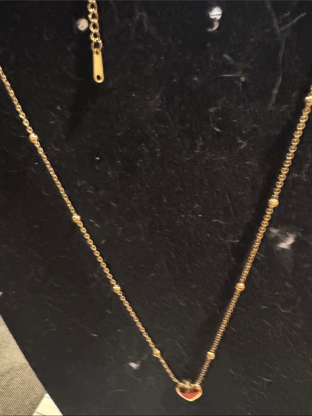 Necklace in gold tone with miniature heart